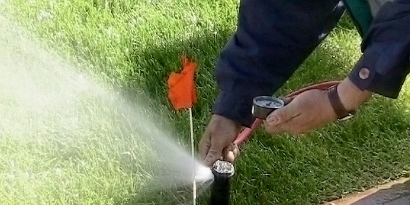 Tech Adjusts Water Pressure for Commercial Irrigation System